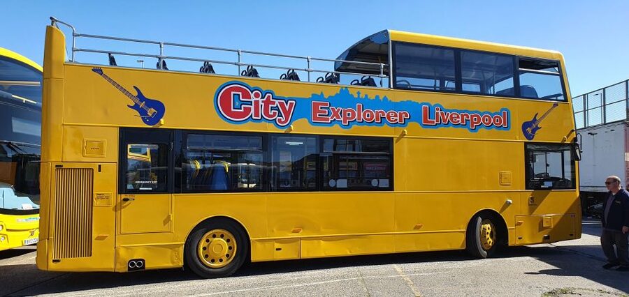 Liverpool: Beatles Explorer Bus Tour Ticket - Pier Head statues and Mathew Street
